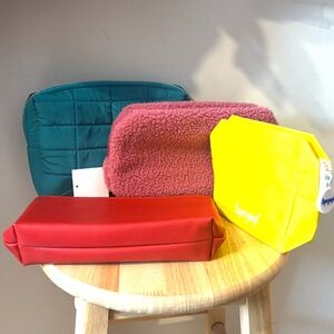 Lot of three collectible Sephora cosmetic bags with a Supergoop bag bonus NWT